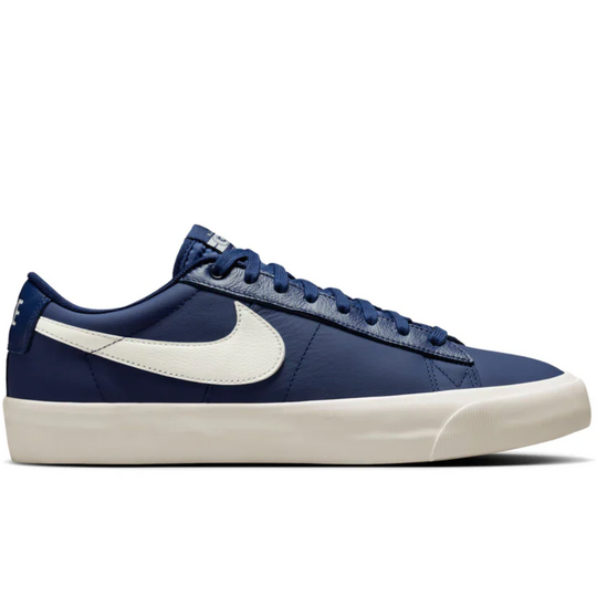 Blue sneaker with a white logo on a white background