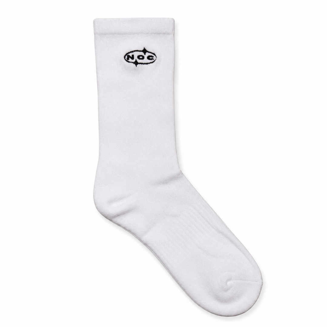 A single white crew sock with a black 'NOC' logo printed on the upper cuff, displayed against a clean white background.