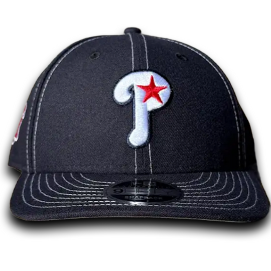 navy baseball cap with a red and white logo on a white background