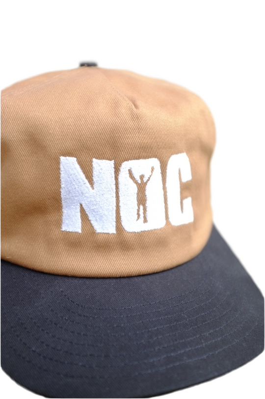 Two-tone cap with 'NOC' logo on a white background