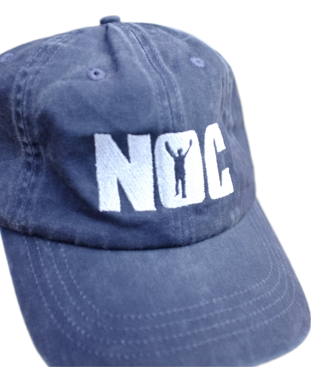 Blue cap with 'NOC' logo on a white background