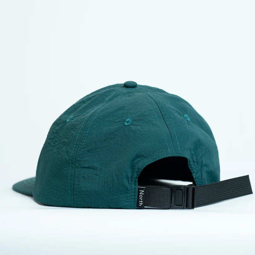 Teal cap with a black nylon strap 