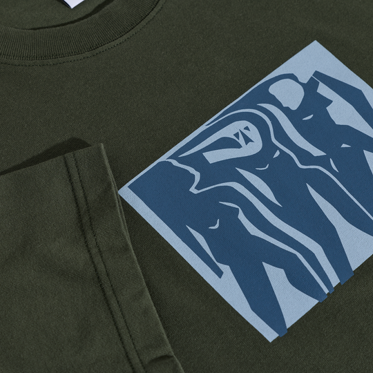 Green polar tee with a blue graphic design on the chest