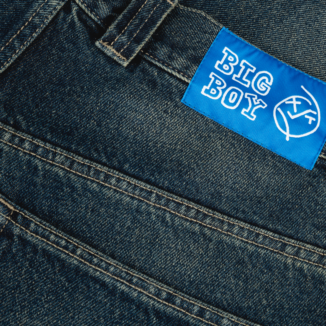 Blue denim jeans with a 'BIG BOY' label on the back pocket.