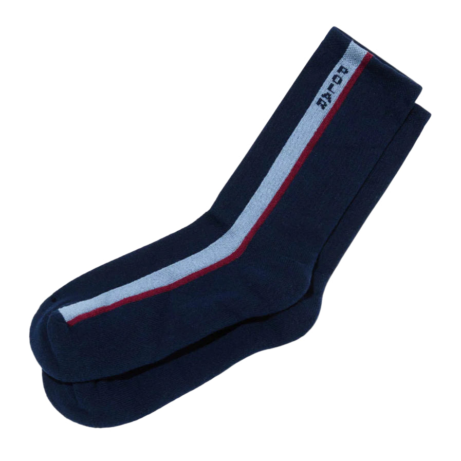 Navy blue socks with white and red stripes on a light gray background