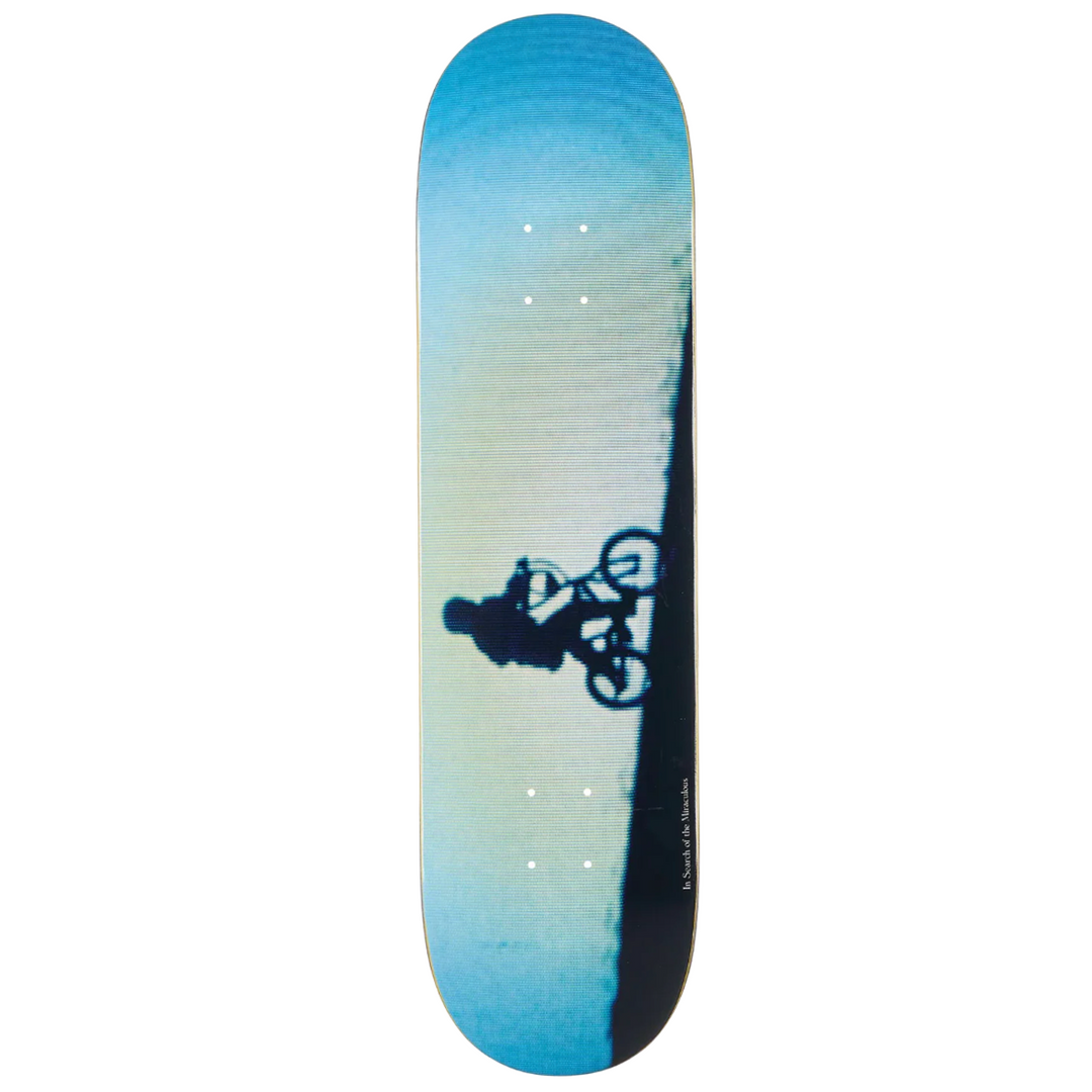 Skateboard deck with a gradient blue and black design on a white background