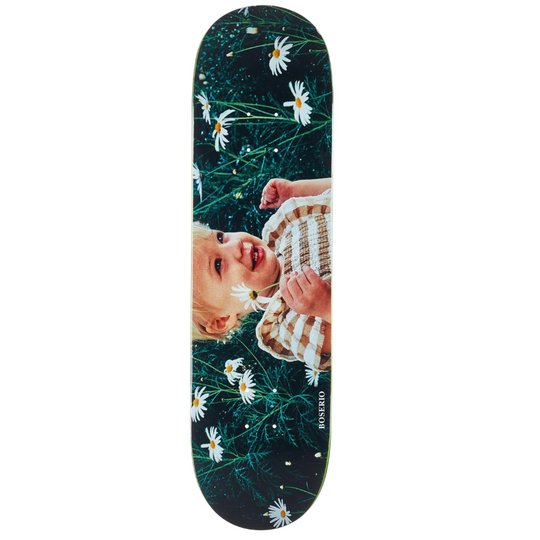 Skateboard deck with a baby and floral design on a dark background