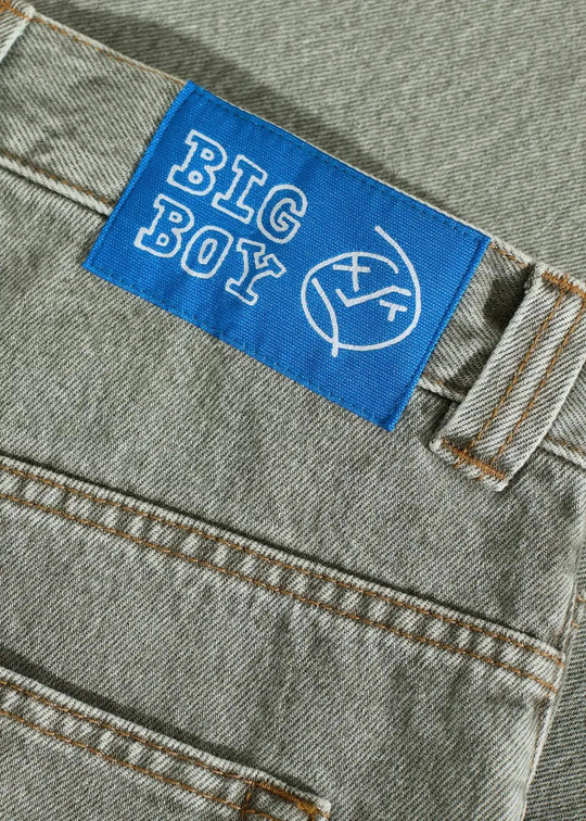 Blue label with 'BIG BOY' logo on a denim jean