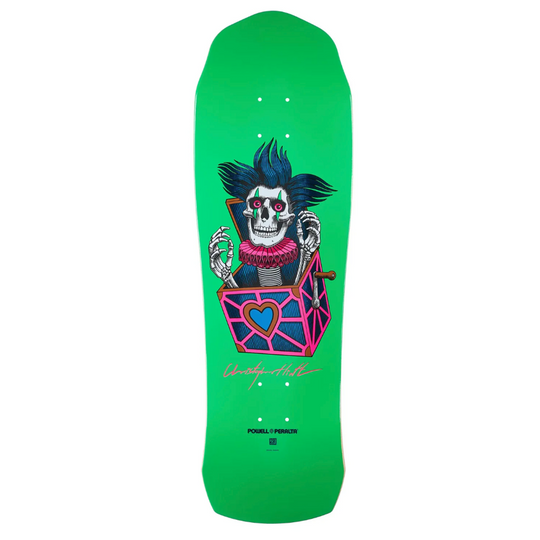 Green skateboard deck with a colorful skull design 