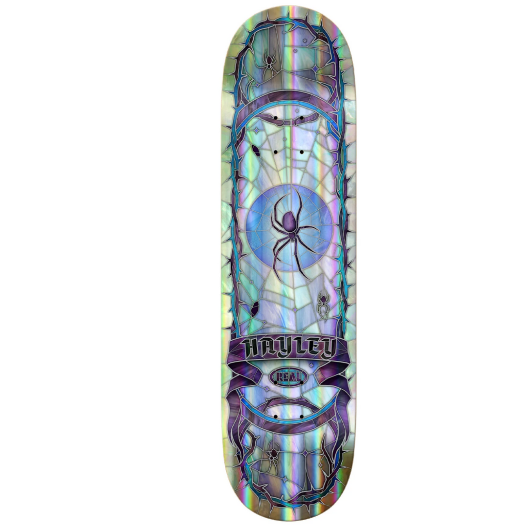 Skateboard deck with spider web design and 'Havalon' branding on a white background