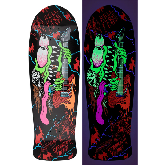 Skateboard deck with colorful design of a creature playing a guitar on a black background.