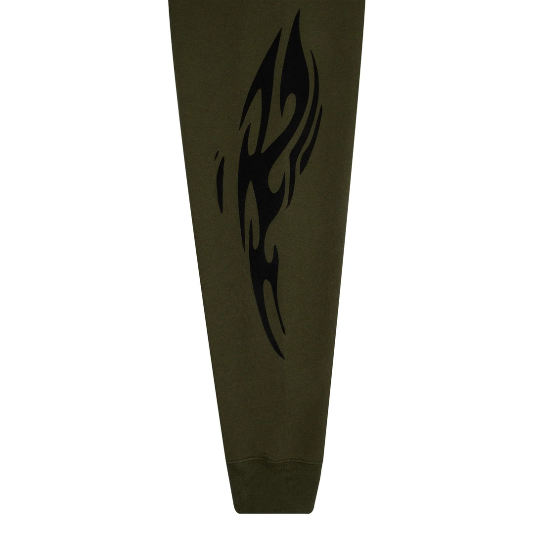 Dark green sweatpants with a black tribal design on a white background