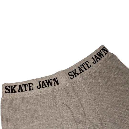 Gray boxer briefs with 'SKATE JAWN' branding 