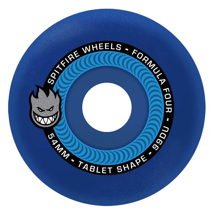 A single blue skateboard wheel with a center hole, featuring the gray and black Spiretire Wheels logo and white text detailing the model 'Spireire Wheels - Formula Four' and specifications '52MM - TABLET SHAPE - 99BU' on a plain white background.