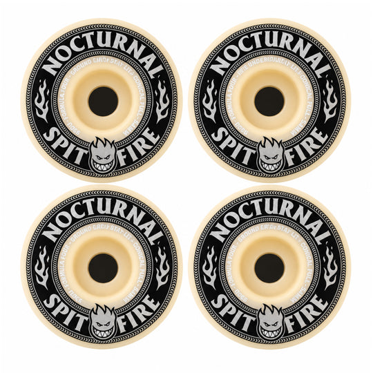 Four skateboard wheels arranged in a 2x2 grid on a plain white background. Each wheel has a cream-colored center and outer rim with a black circular band printed with the words &