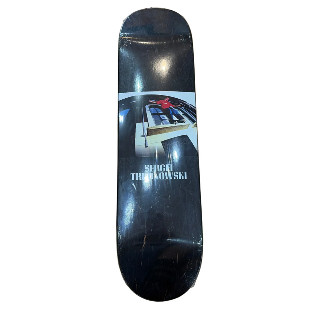 Skateboard deck with a graphic design and 'Sergei Trudnowski' text on a white background