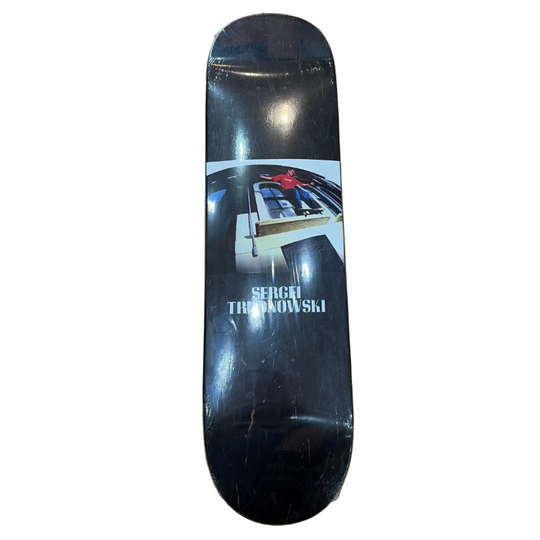 Skateboard deck with a graphic design and 'Sergei Trudnowski' text on a white background