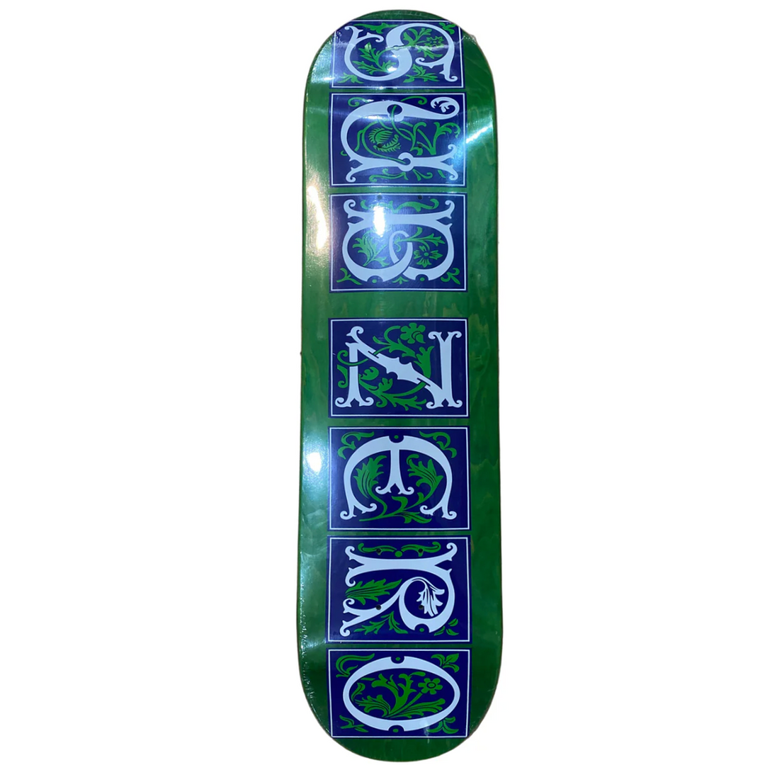 Green skateboard deck with decorative text design on a white background