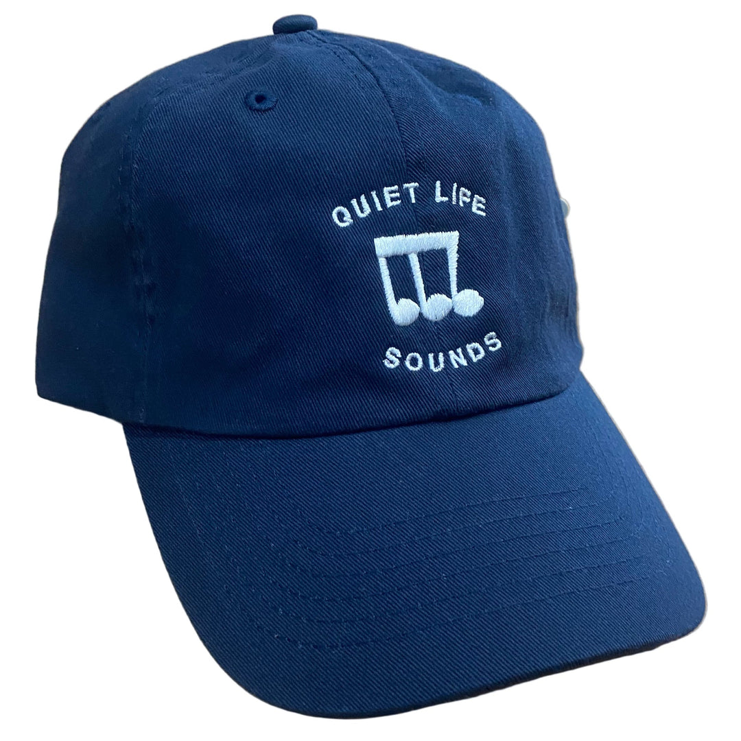 Navy blue cap with 'The Quiet Life Sounds' logo on a white background
