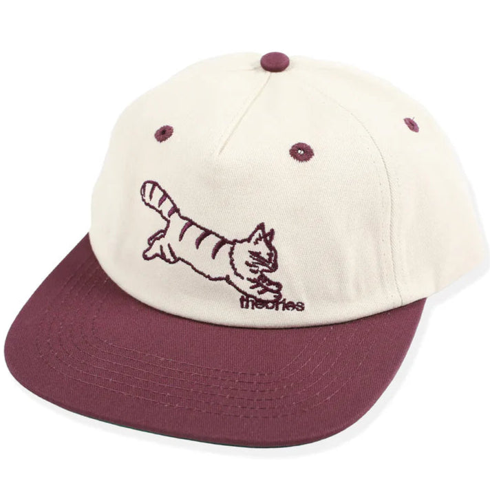 Cap with a cat illustration and 'thechies' branding on a white background