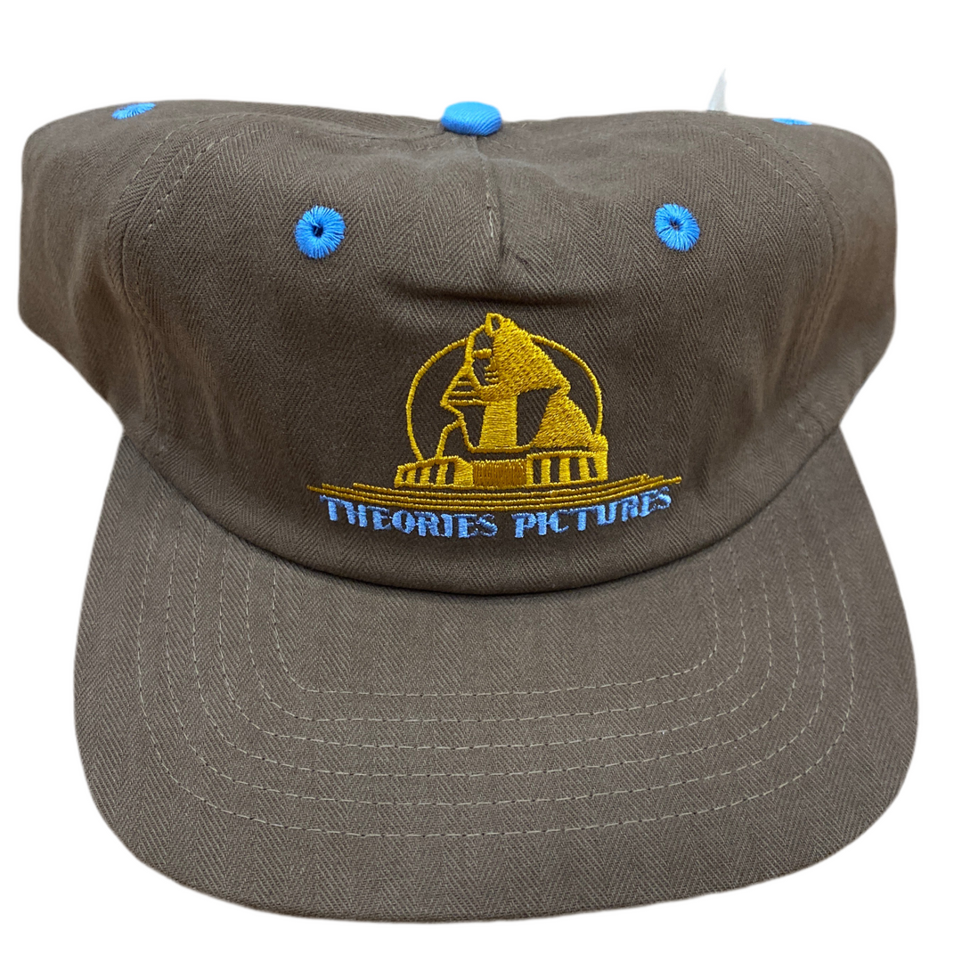 Brown cap with yellow logo and text on a white background