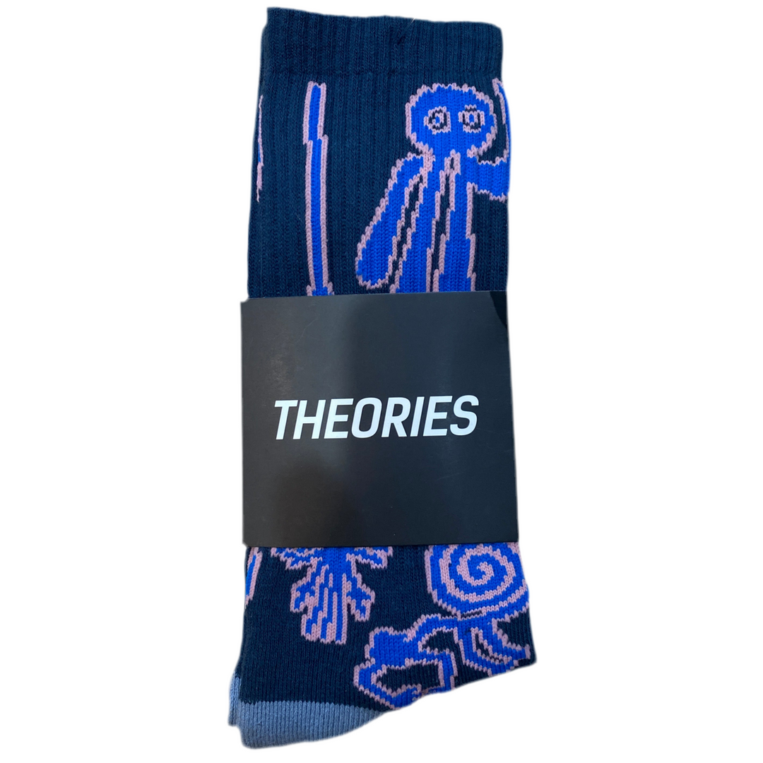 Pair of blue socks with abstract designs on a white background, featuring the brand 'THEORIES'.