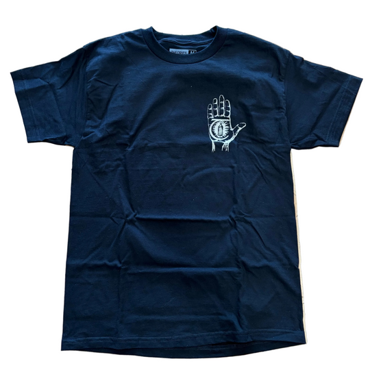 Black t-shirt with a white graphic on a wooden floor