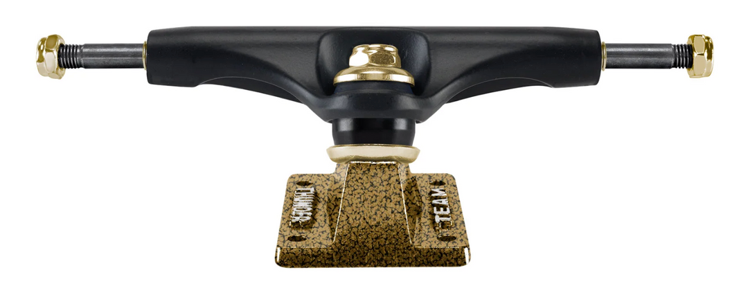 Skateboard truck with black and gold design on a white background