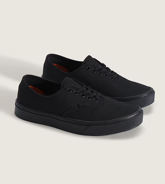 Pair of black sneakers on a white background