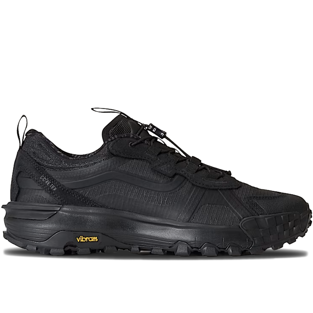 A black Vibram trail running shoe shown in a side profile view against a plain white background.