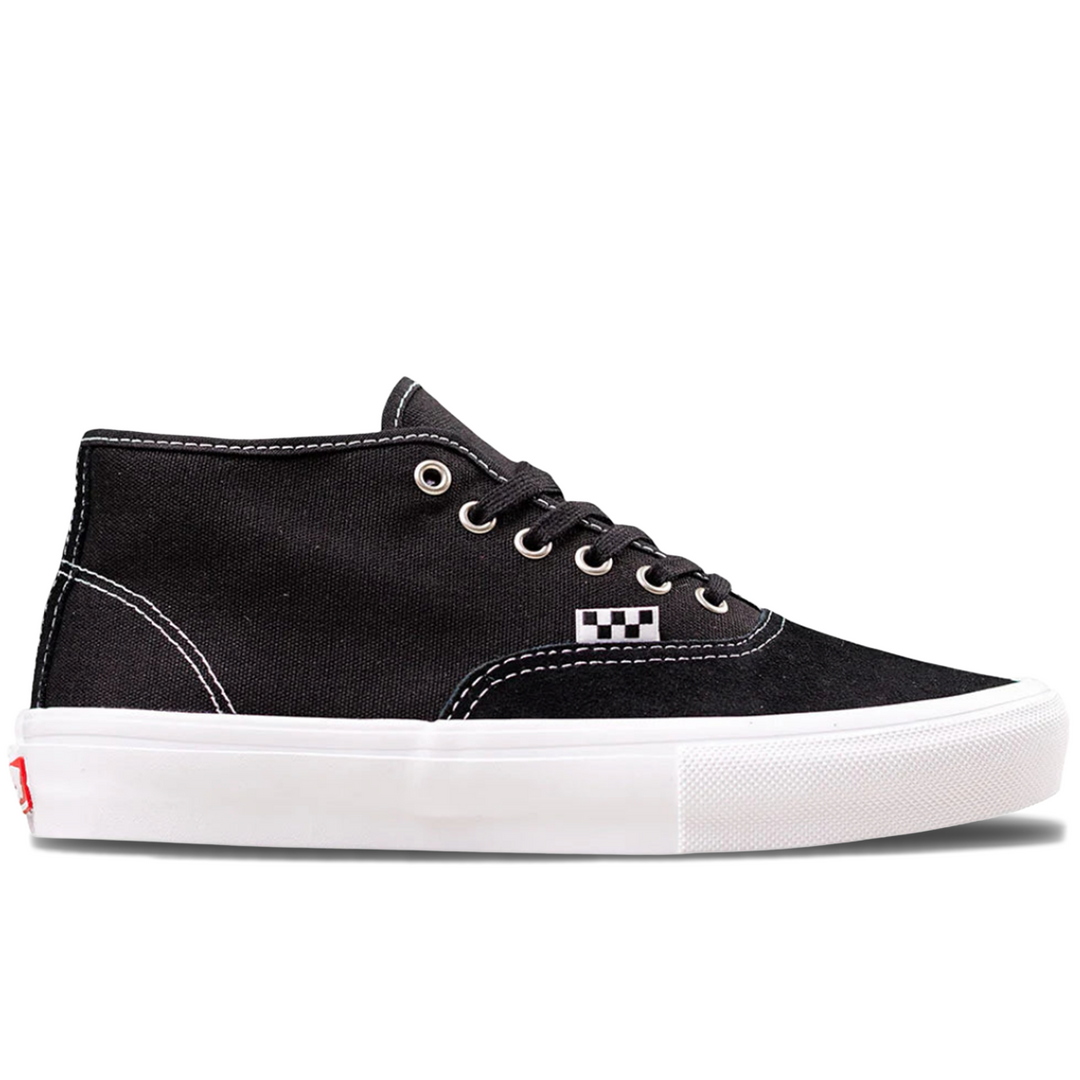 Black vans mid top sneaker with white sole 