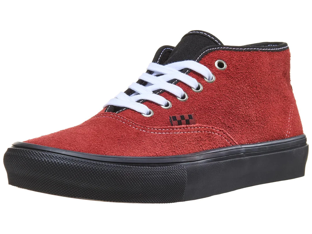 Red high-top sneaker with black sole on a white background