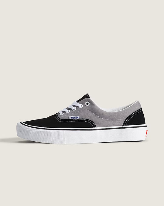 Black and gray low cut sneaker with white sole 
