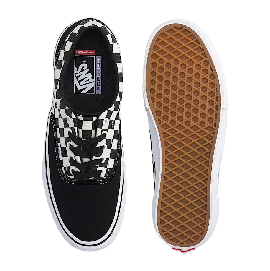 Black and white checkered Vans sneaker with a focus on sole texture.