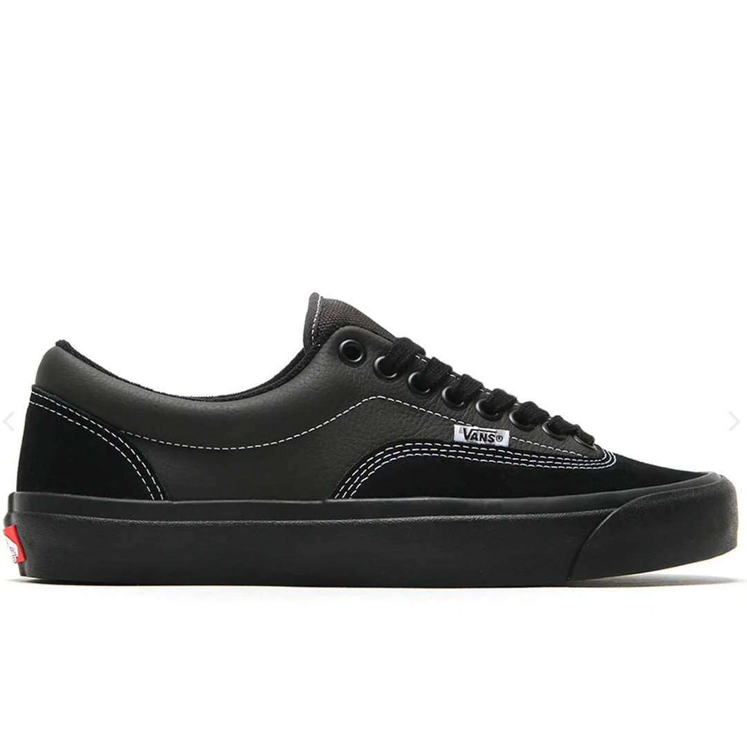 Black Vans sneaker on a white background