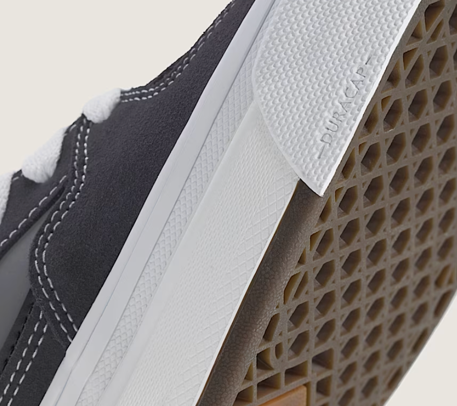 Close-up of a shoe sole with a textured pattern and brand label.