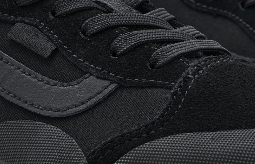 Close-up of a black sneaker with gray accents