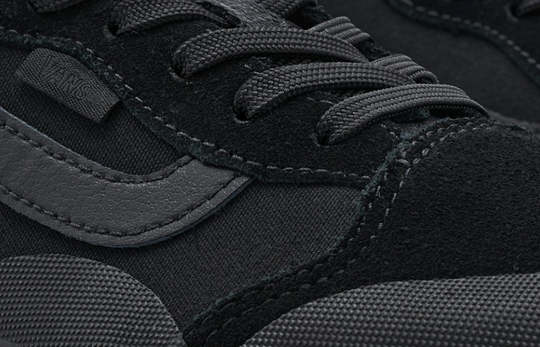 Close-up of a black sneaker with gray accents