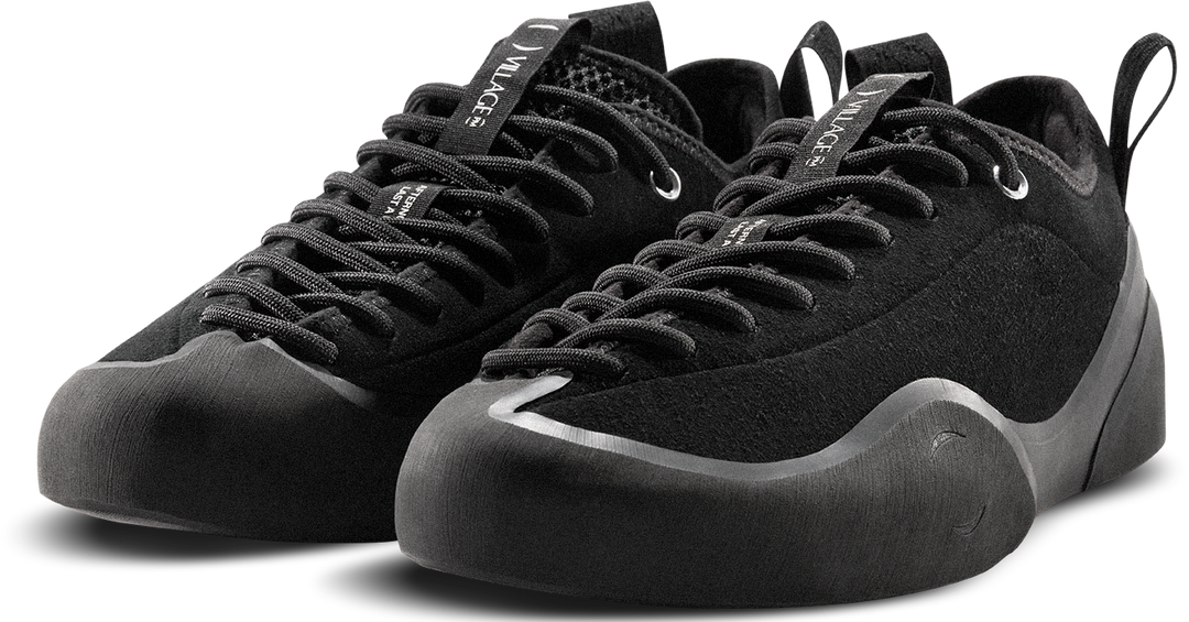 Black climbing shoes with brand logo on a white background