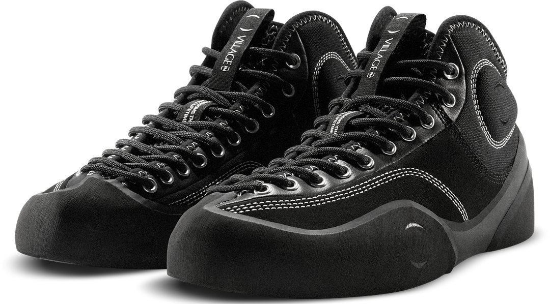Pair of black high-top sneakers on a white background