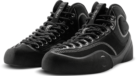 Pair of black high-top sneakers on a white background