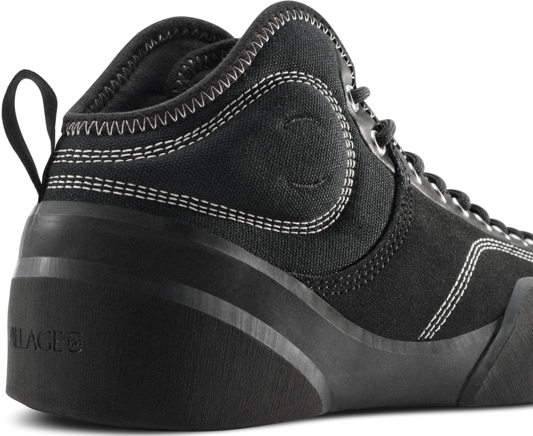 Black high-top sneaker with visible brand logo on a white background