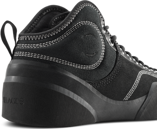 Black high-top sneaker with visible brand logo on a white background