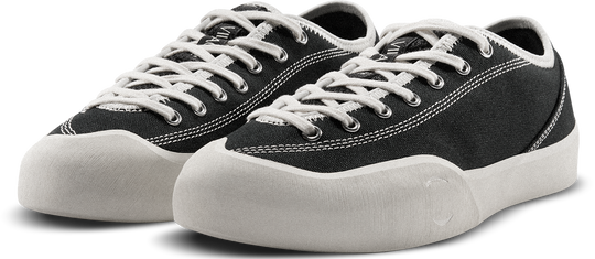 Black sneakers with white laces on a white background