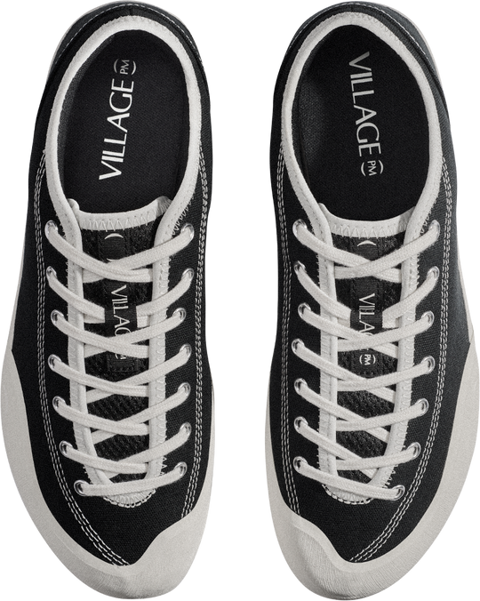 Black sneakers with white laces and &