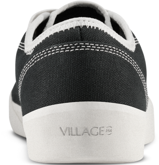 Black sneaker with white sole and &
