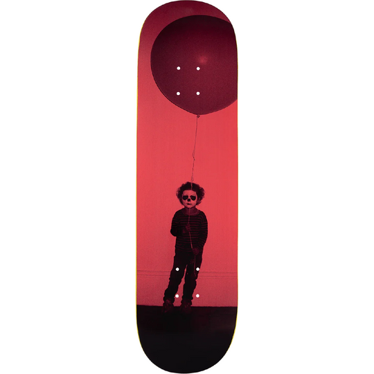 A skateboard deck featuring a graphic print of a child wearing sunglasses and holding a large red balloon against a red background.
