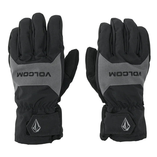 Pair of black and gray gloves with Volcom branding on a light gray background