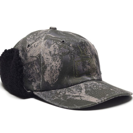 Camouflage baseball cap with ear flaps on a white background