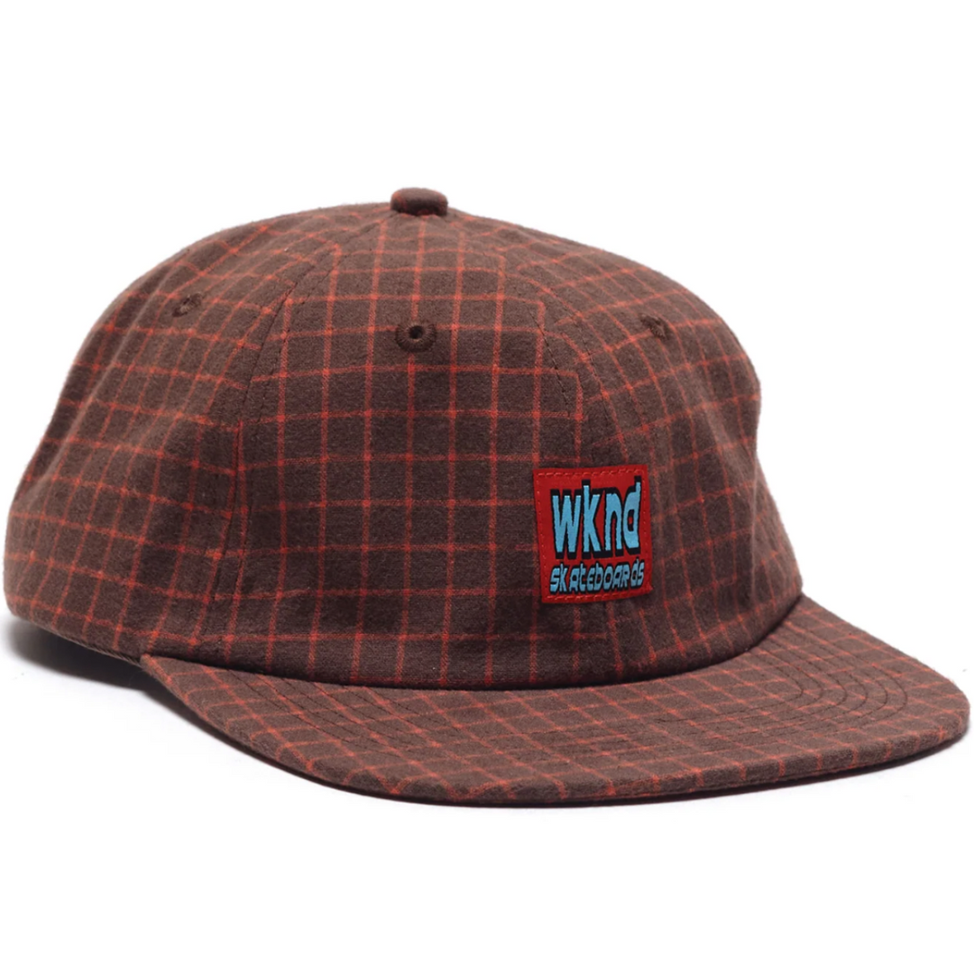 Plaid patterned cap with a logo on a white background